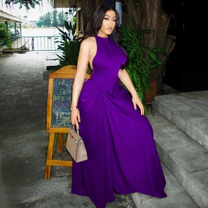 Detail of purple sleeveless backless dress with ruched waist and flowing skirt design