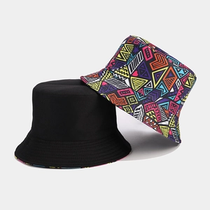 Detail showing two bucket hats in solid black and vibrant geometric graffiti pattern
