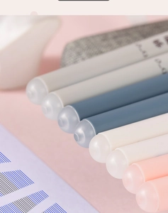 Close-up of erasable gel pens with frosted caps in soft Morandi pastel colors