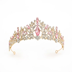 Luxury gold bridal crown with pink crystals and floral vine patterns on white background