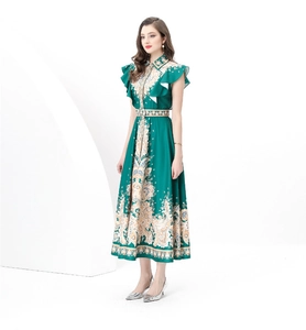 Detail of green paisley print maxi dress showing ruffled sleeves and matching belt waist