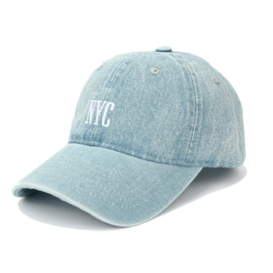 Close-up of white 3D NYC embroidery on washed light blue denim baseball cap