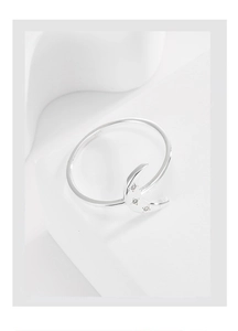 Detailed macro view of S925 sterling silver moon ring with star-shaped cubic zirconia