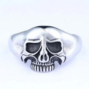 Gothic punk style silver stainless steel skull ring for men on a clean white background
