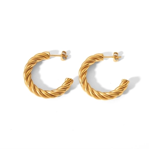 Detail view of gold-plated stainless steel C-shape twisted hoop earrings with a butterfly back