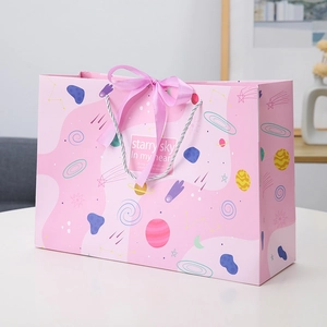 Pink starry sky gift paper bag with silver handles and ribbon bow for celebrations