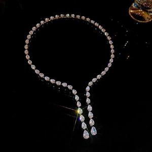 Macro shot of silver Y-shaped choker necklace with drop-shaped zircon crystals