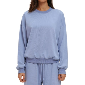 Lavender crewneck sweatshirt and drawstring joggers set with a relaxed fit for sports