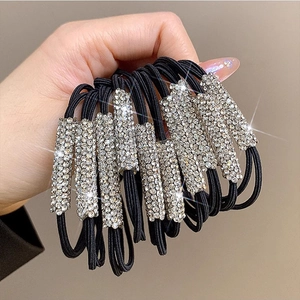 Black high-elastic hair tie featuring a rectangular silver base with sparkling rhinestones