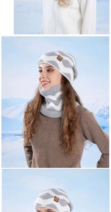 Detail of grey and white wave patterned knit hat and neck warmer with leather patch