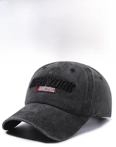 Close-up of 3D embroidery detail on vintage washed cotton baseball cap with text