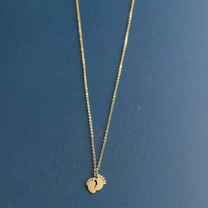 Gold stainless steel baby feet pendant necklace with double-sided polished finish