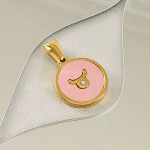 Detail of 18K gold titanium constellation necklace featuring Taurus symbol on pink enamel