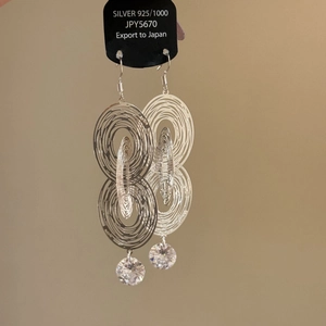 Minimalist S925 silver dangling earrings with concentric hollow circles and zircon