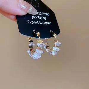Elegant 18k gold plated crystal geometric hoop earrings on black jewelry display card