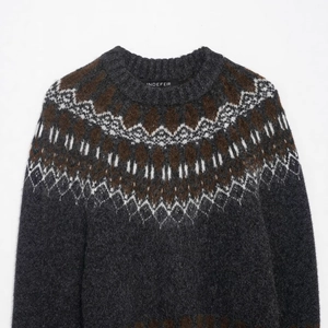 Dark grey Nordic Fair Isle knit sweater with geometric jacquard patterns on neckline