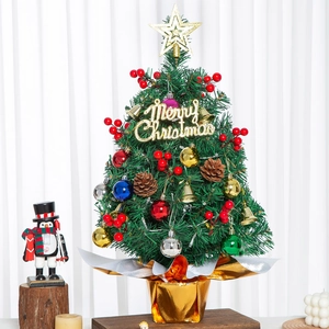 Detailed close-up of a decorated 60cm tabletop Christmas tree with festive ornaments