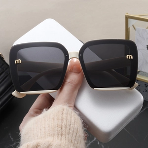 Oversized black and cream square sunglasses for women with high UV protection and gold detail