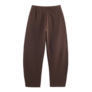 Detailed view of dark brown velvet lounge pants with elastic waistband and high-quality fabric