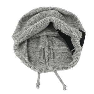 Grey knit drawstring slouchy beanie with four-pointed star pattern and chunky texture