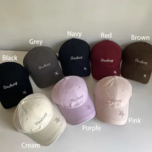Dashing star embroidered cotton baseball caps shown in eight assorted vibrant colors