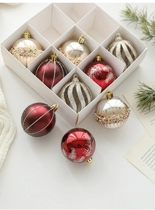 Detail of glittered 6cm Christmas ball ornaments in red and gold for festive tree decor