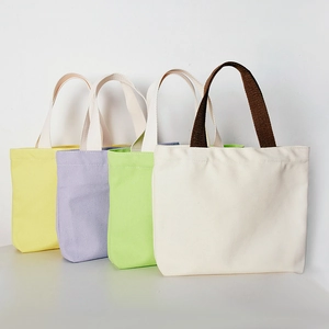 Colorful canvas tote bags in yellow, lavender, green, and beige for daily commuting