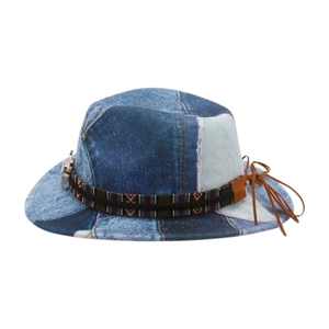 Detail of patchwork denim fedora featuring ethnic woven band and brown leather tassels