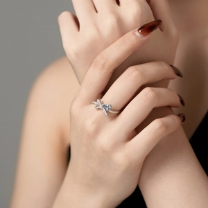 Close-up of S925 silver ring featuring a blue water-drop stone and butterfly detail