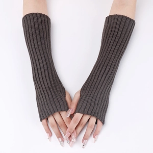 Detailed knit texture of long dark grey fingerless gloves showing ribbed wool pattern