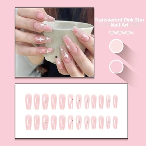 Pink press-on nails set featuring white stars and rhinestones in coffin shape