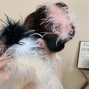 Detail of fluffy feather hair claws with sparkling rhinestones in various colors