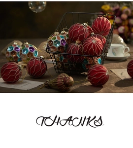 Festive Christmas ball ornaments set with red gold-glitter and mosaic patterns in a basket