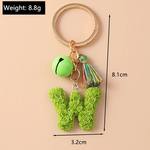 Detailed view of green rose resin W-letter keychain with size and weight metrics