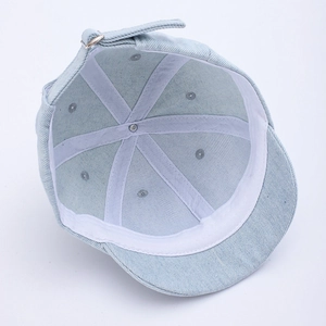 Internal structure of light blue denim baseball cap with sweatband and reinforced seams