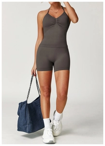 Detailed view of dark grey seamless yoga set with ruched halter top and high-waist shorts