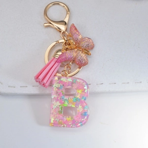 Pink resin letter B keychain with colorful butterfly sequins and leather tassel