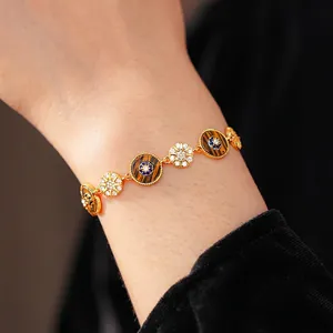 Vintage gold zircon circular bracelet with sunburst eye design on female wrist