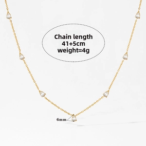 Detailed view of gold chain necklace with pear-shaped cubic zirconia and measurements