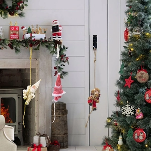 Climbing Santa Claus figurines set for festive fireplace and wall decorations