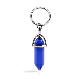 Detail of blue hexagonal crystal pendant keychain with polished silver metal clasp