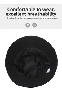 Detail of breathable mesh lining and adjustable drawstring inside the black bucket hat