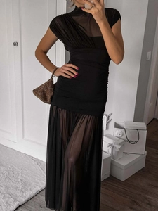 Elegant sleeveless black bodycon maxi dress with sheer mesh paneling and ruching details