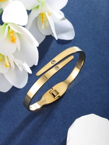 Elegant gold-plated stainless steel hinge bangle featuring two clear cubic zirconia accents