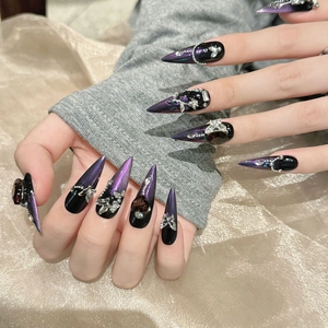 Handmade stiletto press-on nails in black purple cat-eye design with luxury crystal rhinestones
