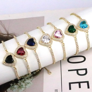 Detail showing seven colors of adjustable heart zircon bracelets with gold plating