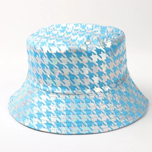 Detail of blue and holographic silver houndstooth bucket hat with shiny metallic finish