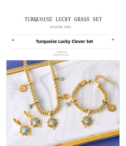 Macro shot of gold titanium steel jewelry set with round turquoise clover pendants