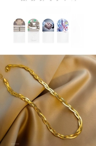 Detail of 18K gold-plated triple strand snake chain with lobster clasp on silk