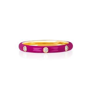 Macro shot of 18K gold plated ring with fuchsia enamel and three round zircon stones